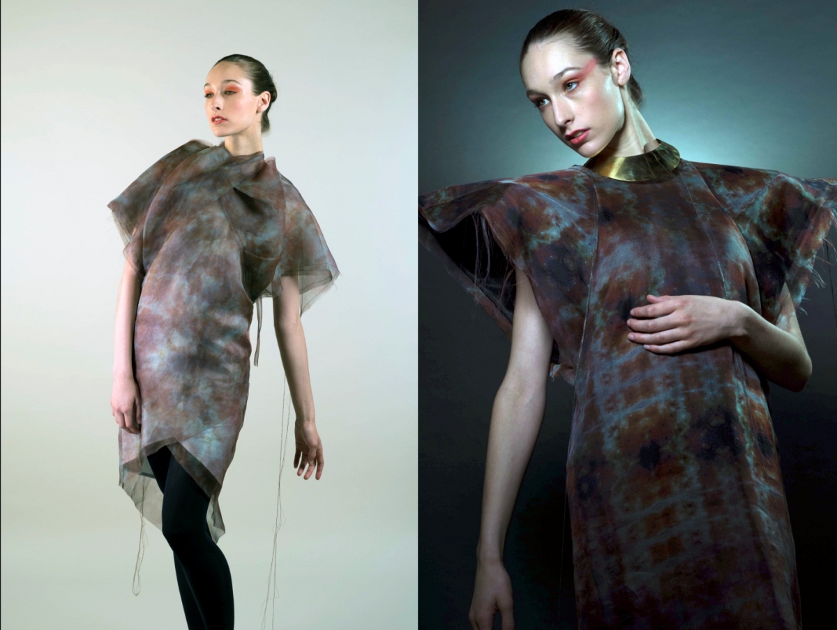 A woman poses in two different futuristic-style tunics. Both designs have swirling grey, blue and brown-coloured patterns and large, pointed shoulders.